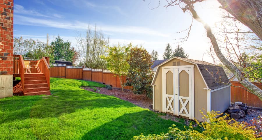 Fenced backyard with storage shed in Lafayette